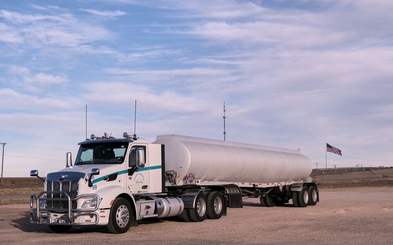 White tanker truck hauling fuel